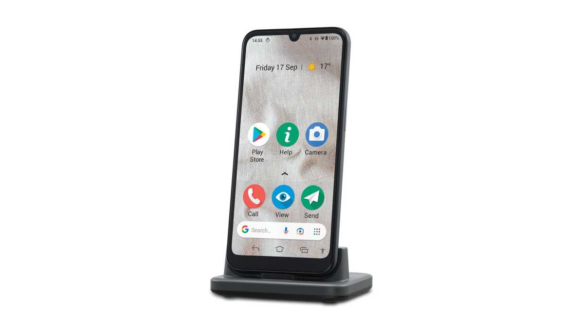 A Doro 8100 smartphone in a charging cradle